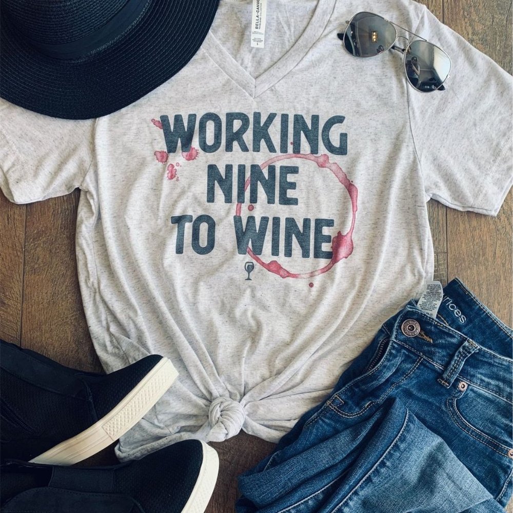 Graphic v-neck tee with "Working Nine to Wine"
